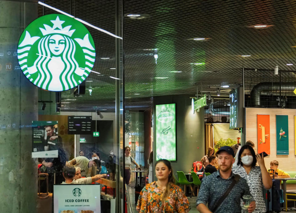 VIENNA, AUSTRIA - 2022/08/29: People walk next to Starbucks at Vienna Central Station. (Photo by Igor Golovniov/SOPA Images/LightRocket via Getty Images)