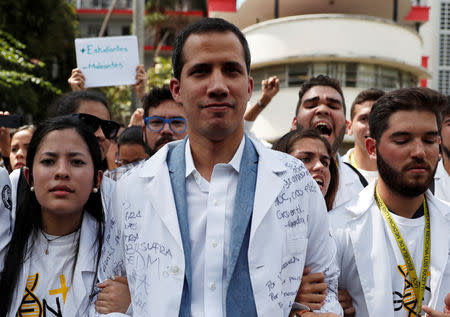 Venezuelan opposition leader and self-proclaimed interim president Juan Guaido takes part in a protest against Venezuelan President Nicolas Maduro's government outside the hospital in Caracas, Venezuela January 30, 2019. REUTERS/Carlos Garcia Rawlins