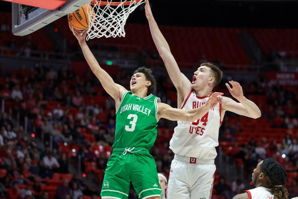 Utah Valley Wolverines guard Drake Allen (3) goes to the hoop ahead of Utah Utes center Lawson Lovering (34) at the Huntsman Center in Salt Lake City on Saturday, Dec. 16, 2023. | Spenser Heaps, Deseret News