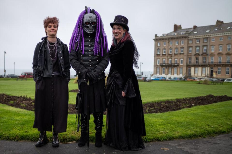 WHITBY, ENGLAND – APRIL 29: Robyn (L), Graham and Fran (R) Wickham from Pontefract pose for a picture as they attend during the Whitby Goth Weekend on April 29, 2023 in Whitby, England. (Photo by Ian Forsyth/Getty Images)