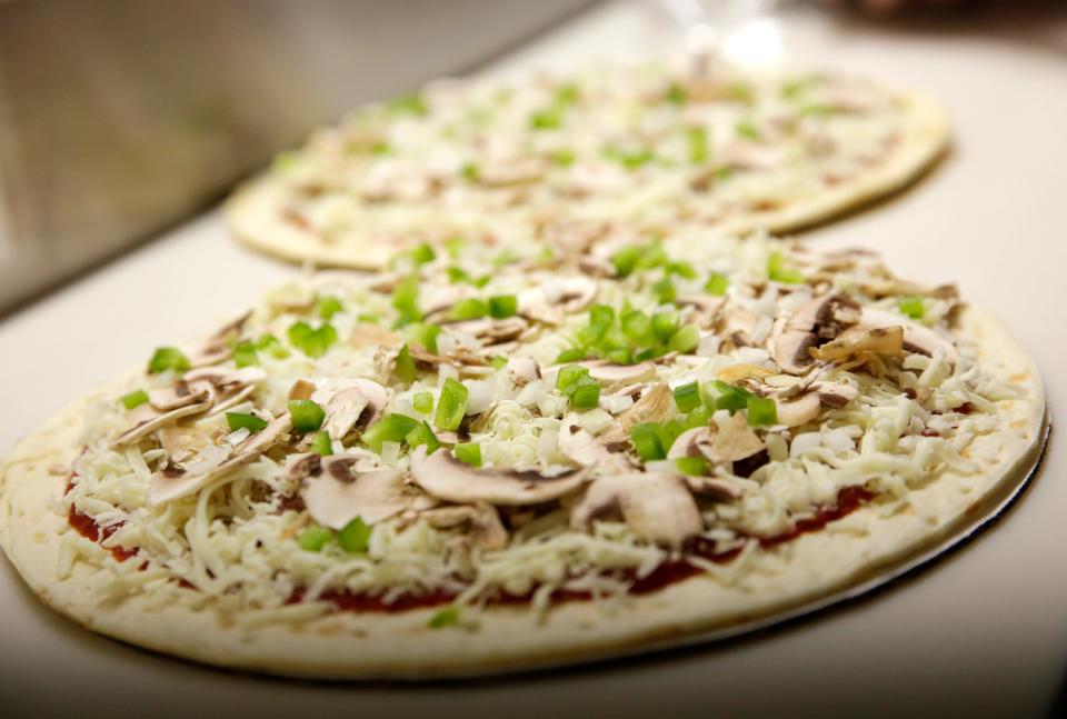 Chef Fresh Pizza shreds the cheese, slices fresh mushrooms and prepares other ingredients in-house.