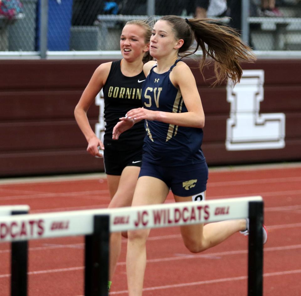 Corning's Sarah Lawson, left, and Susquehanna Valley's Brynn Hogan are side-by-side late in the girls 1,500 meters at the Southern Tier Athletic Conference track & field championships May 18, 2022 at Johnson City High School. Lawson won and Hogan took third behind Corning's Faithe Ketchum.