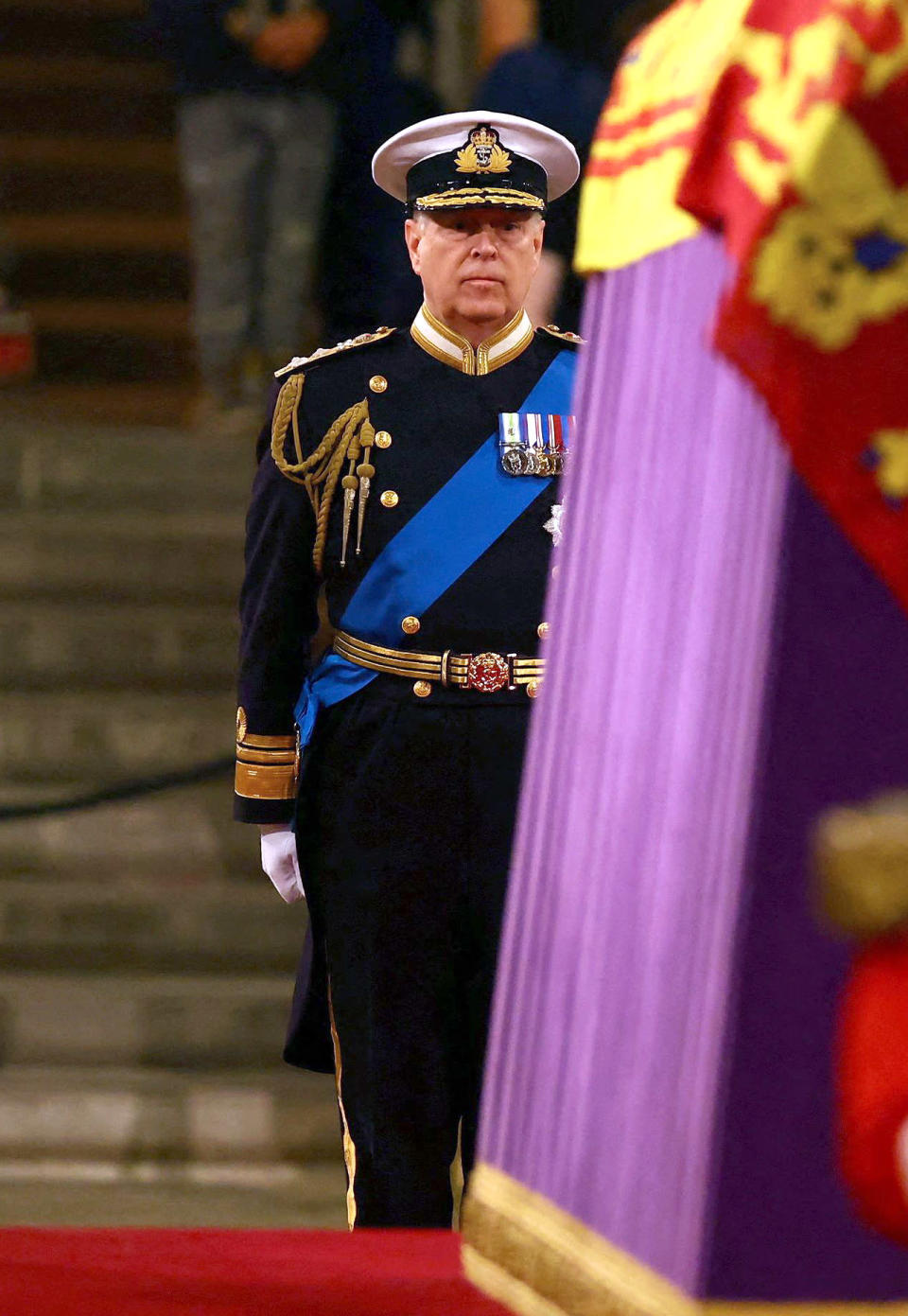 <p>Although it was announced earlier this week that only working members of the royal family would wear military uniforms for the Queen's funerary events, a <a href="https://people.com/royals/prince-harry-prince-andrew-will-not-wear-military-uniforms-queen-elizabeth-funeral/" rel="nofollow noopener" target="_blank" data-ylk="slk:special exception" class="link ">special exception</a> was made for Prince Andrew to wear his military uniform for Friday's vigil as a sign of respect to his late mother. </p>