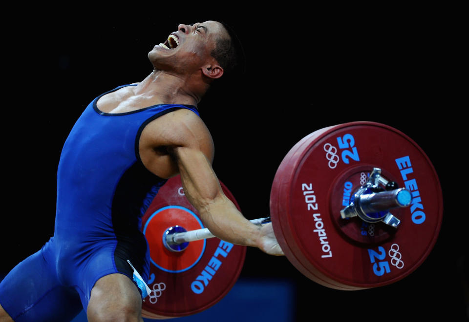 LONDON, ENGLAND - JULY 30: Manuel Minginfel of Federated States of Micronesia competes in the Men's 62kg Weightlifting on Day 3 of the London 2012 Olympic Games at ExCeL on July 30, 2012 in London, England. (Photo by Laurence Griffiths/Getty Images)