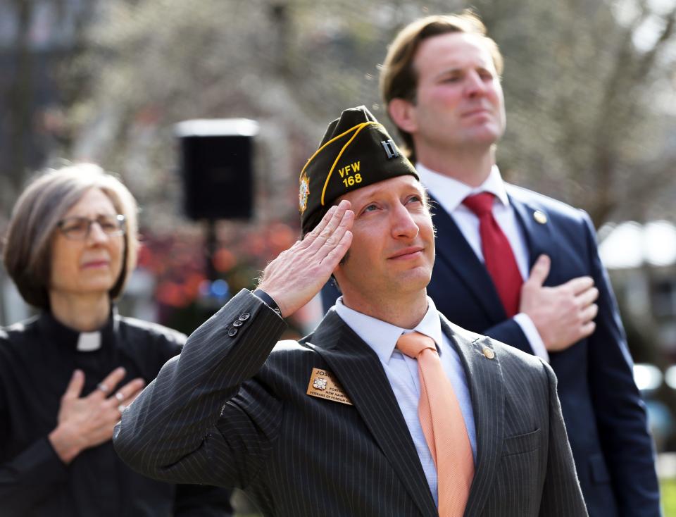 Josh Denton, Commander of VFW Post 168, center, takes part in the Veterans Day ceremony in Goodwin Park in Portsmouth as Rev. Ellen Quaadgras from South Church and Mayor Deaglan McEachern also take part Nov. 11, 2022.