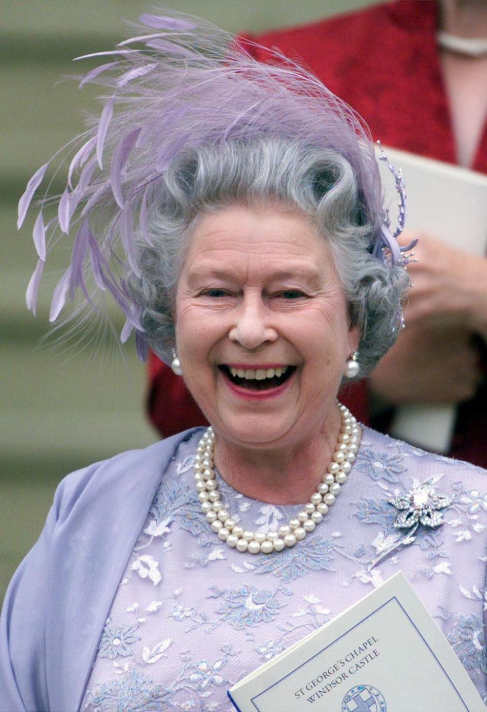 <p>Queen Elizabeth II leaving St. George's Chapel in Windsor after the wedding of Prince Edward on June 19, 1999.</p>