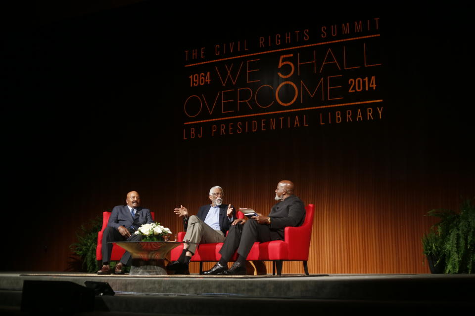 Football Hall of Famer Jim Brown, left, Basketball Hall of Famer Bill Russell, center, and moderator Harry Edwards take part in the "Sports and Race: Leveling the Playing Field" panel during the Civil Rights Summit on Wednesday, April 9, 2014, in Austin, Texas. Brown and Russell discussed using their platforms in their respective sports to raise awareness for civil rights. (AP Photo/Jack Plunkett)