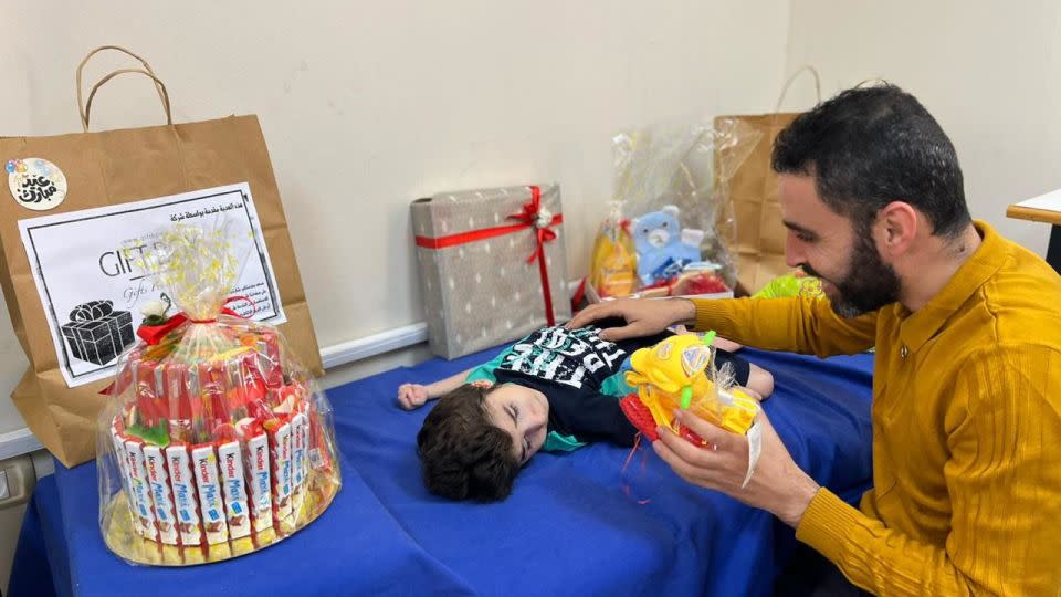 Hazem Saeed Al-Naizi (right) and Ayas (left) celebrate Eid at the orphanage in Gaza City, on May 12, 2022. - Hazem Saeed Al-Naizi