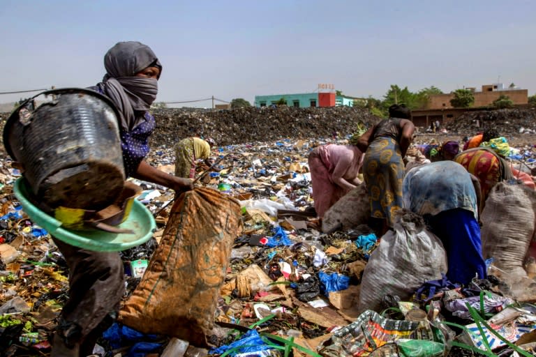 Scavengers look for reusable or recyclable material at a dump in Bamako, Mali