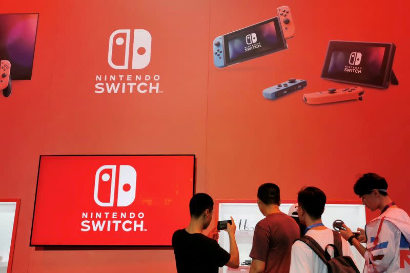 FILE PHOTO: Visitors are seen at a booth of Nintendo Switch at the China Digital Entertainment Expo and Conference, also known as ChinaJoy, in Shanghai