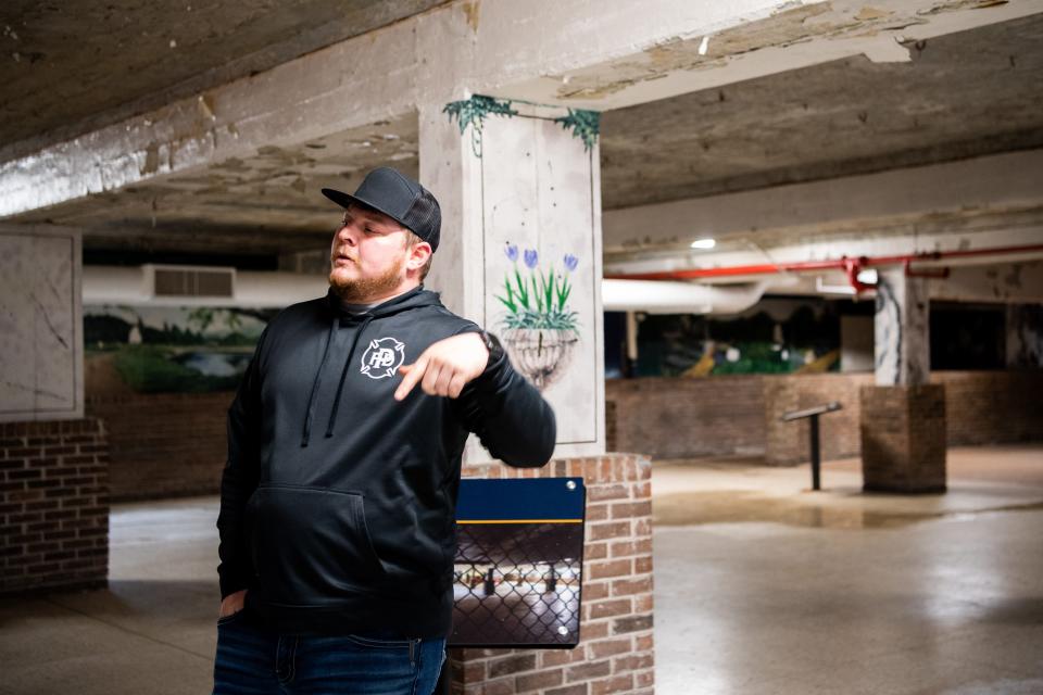 Caanan Brock, master distiller for Brushy Mountain Distillery, talks while inside the cafeteria at the Historic Brushy Mountain State Penitentiary in Petros, Tenn., on Thursday, March 2, 2023. The former state penitentiary is home to Brushy Mountain Distillery. 