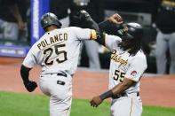 Pittsburgh Pirates' Gregory Polanco (25) celebrates with Josh Bell (55) after hitting a two-run home run off Cleveland Indians starting pitcher Carlos Carrasco during the fourth inning of a baseball game Friday, Sept. 25, 2020, in Cleveland. (AP Photo/Ron Schwane)