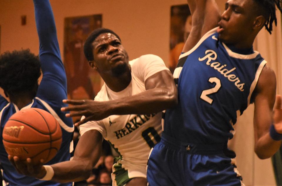 Herkimer College General Oladele Oladitan attempts an off-balance shot with Nahjhime Kirton (2) defending for Fulton-Montgomery Community College March 3. Both Region III tournament finalists are in the 12-team field this week for the NJCAA's Division III national tournament in Herkimer.