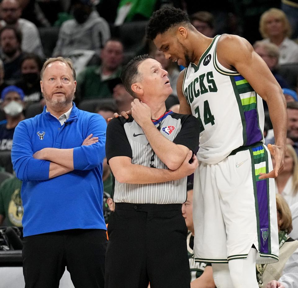 Bucks forward Giannis Antetokounmpo talks with NBA referee Pat Fraher after Antetokounmpo was called for a foul during the first half Saturday.