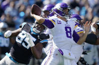 Minnesota Vikings quarterback Kirk Cousins (8) works in the p[ocket against the Carolina Panthers during the first half of an NFL football game, Sunday, Oct. 17, 2021, in Charlotte, N.C. (AP Photo/Gerald Herbert)