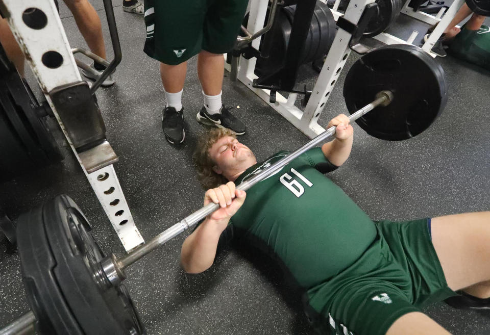 Venice High guard Matthew Peavley, who currently holds the team's all-time bench-pressing record at 435 pounds, works out on Tuesday.
