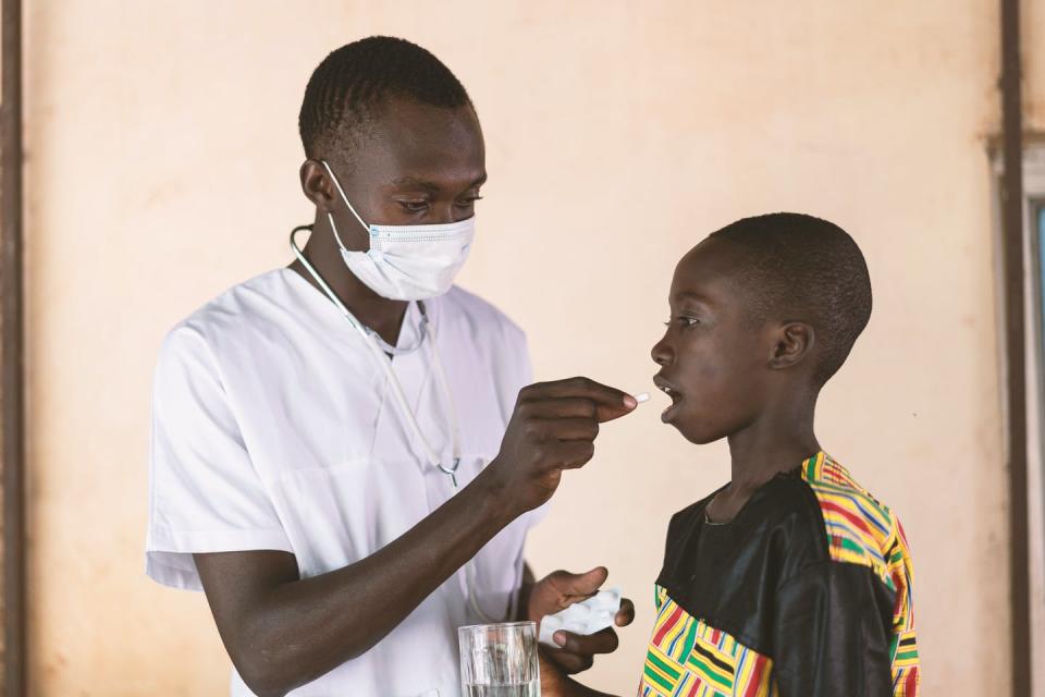 Doctor treats a young boy