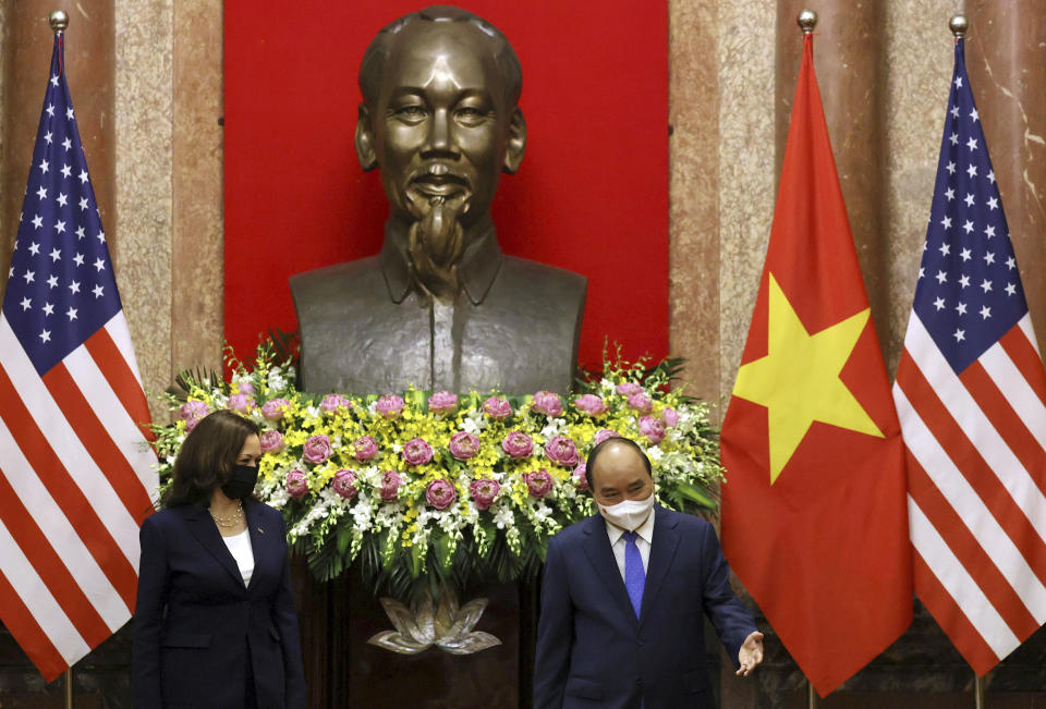 FILE - U.S. Vice President Kamala Harris, left, meets Vietnam's President Nguyen Xuan Phuc in the Presidential Palace in Hanoi, Vietnam, Aug. 25, 2021. Harris has visited more countries in Southeast than any other region. It's a sprawling constellation of nations, many of them eager for the personal touch of an American leader, and Harris has spent the past few years making the rounds. (Evelyn Hockstein/Pool Photo via AP, File)