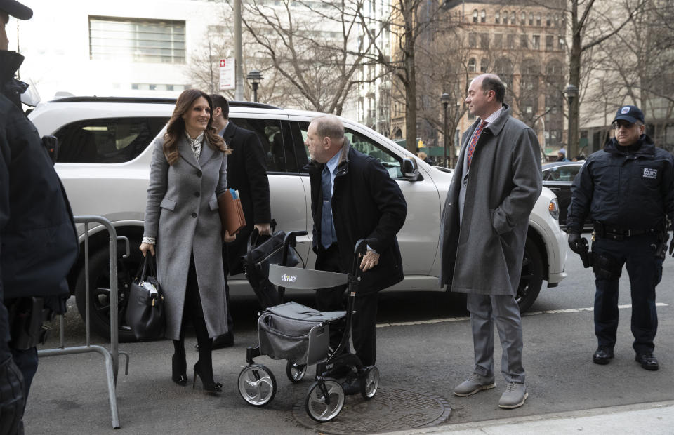 Harvey Weinstein, center, arrives at court with his attorney Donna Rotunno, left, for his trial on charges of rape and sexual assault, Wednesday, Jan. 29, 2020 in New York. (AP Photo/Mark Lennihan)