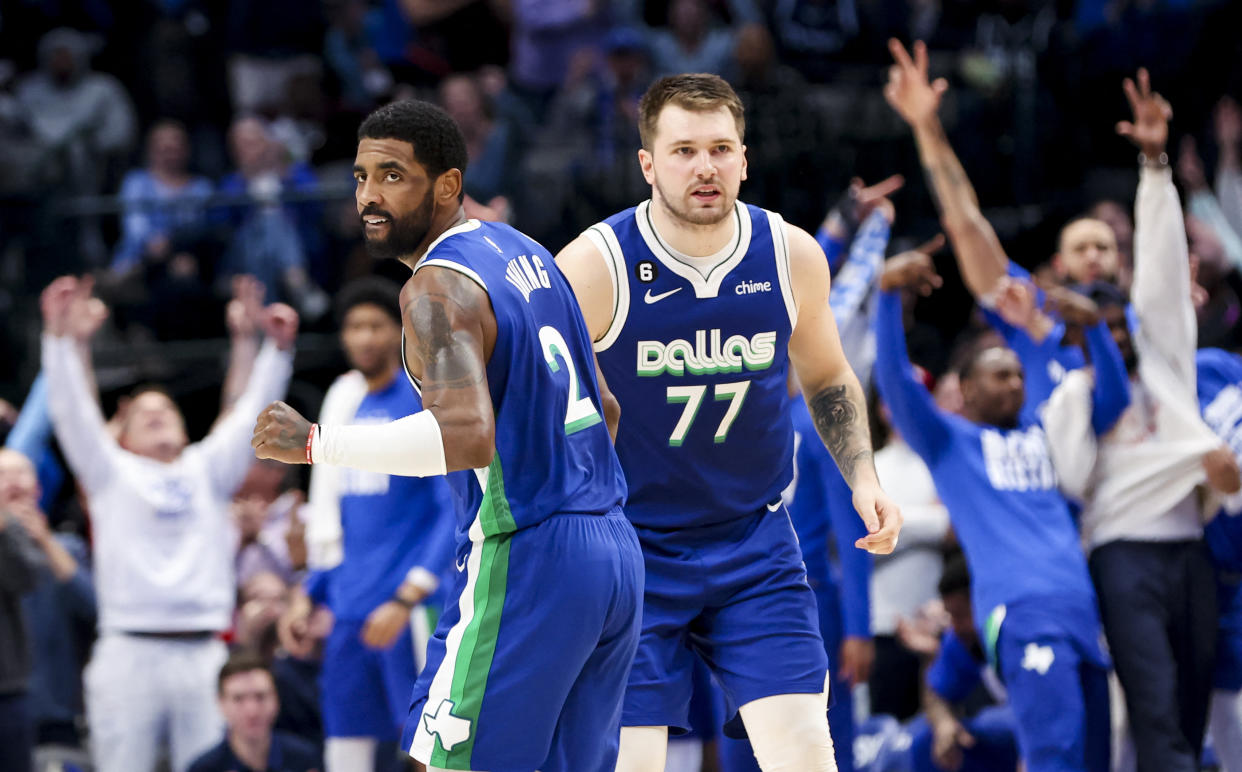 Dallas Mavericks guard Kyrie Irving celebrates with Luka Doncic during a February game at the American Airlines Center in Dallas. (Kevin Jairaj/USA TODAY Sports)