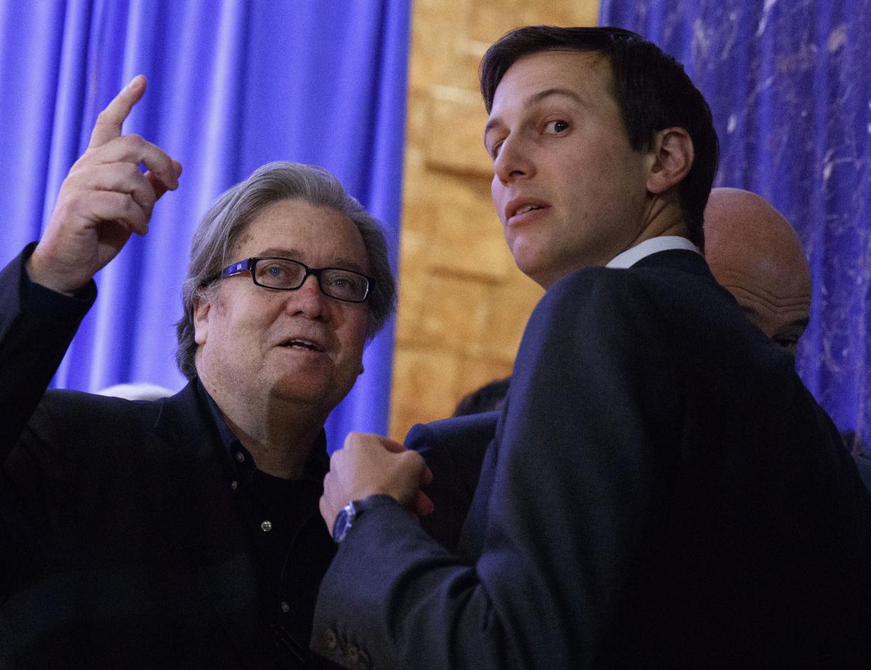 Steve Bannon, chief strategist for President-elect Donald Trump, left, talks with Jared Kushner before the start of a President-elect Donald Trump's news conference in the lobby of Trump Tower in New York, Wednesday. 