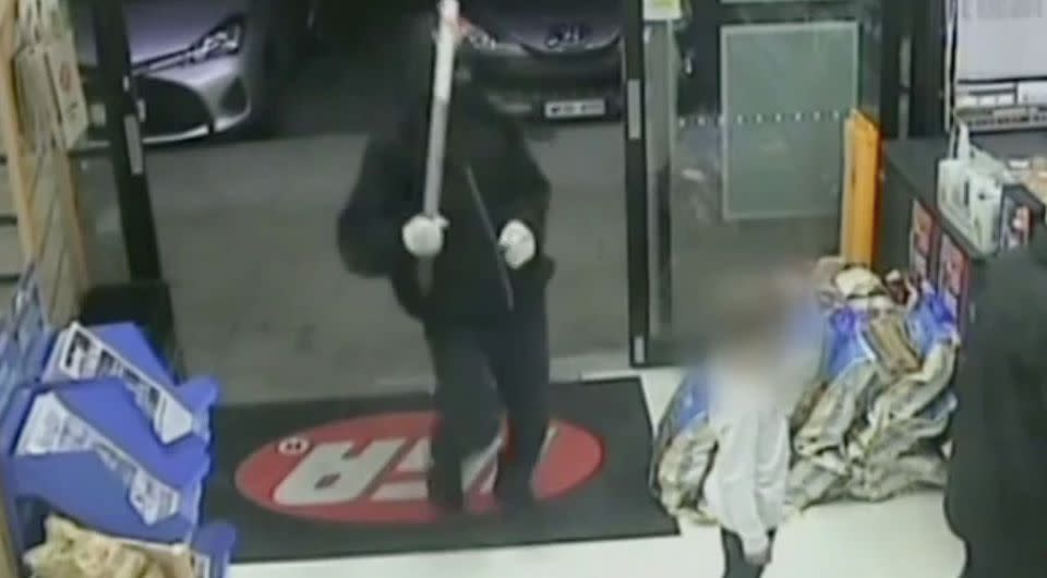 One of the robbers walked into the Bentleigh IGA armed with a nail-embedded pole. Source: 7 News