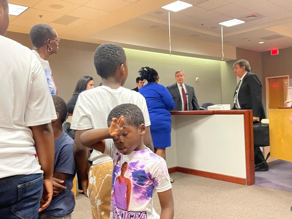 Makita Lucas talks with Assstant State Attorney Bill Respess as family members, including Passion Lucas' children, leave the courtroom after the March 16, 2021 hearing.