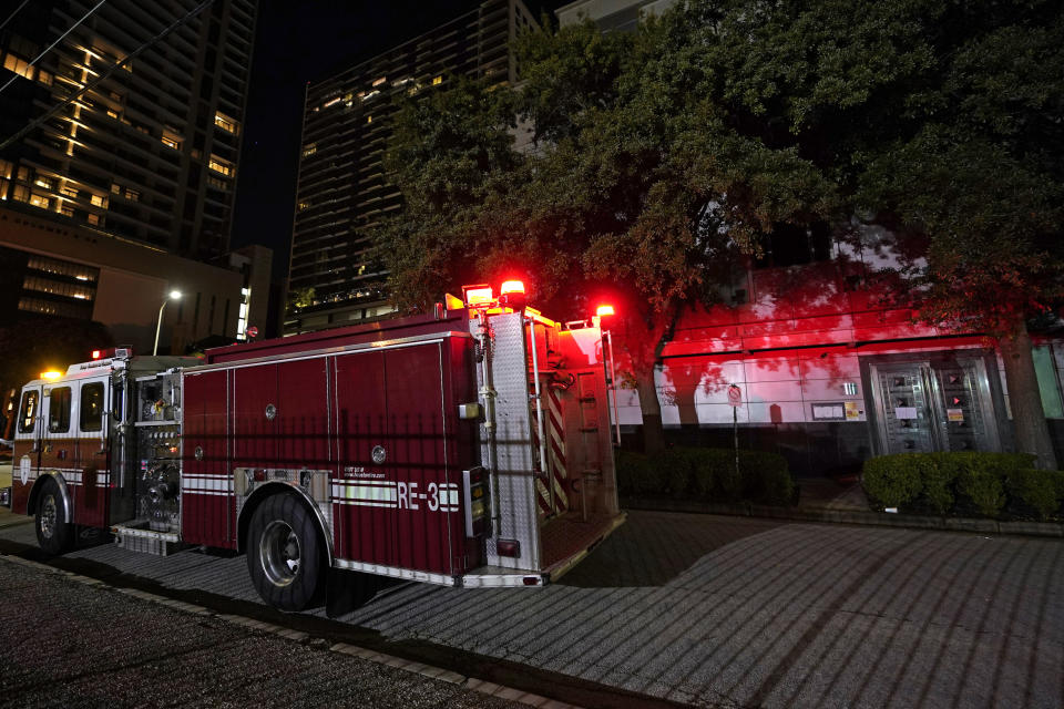 A firetruck is positioned outside the Chinese Consulate Wednesday, July 22, 2020, in Houston. Authorities responded to reports of a fire at the consulate. Witnesses said that people were burning paper in what appeared to be trash cans, according to police. China says the U.S. has ordered it to close its consulate in Houston in what it called a provocation that violates international law. (AP Photo/David J. Phillip)