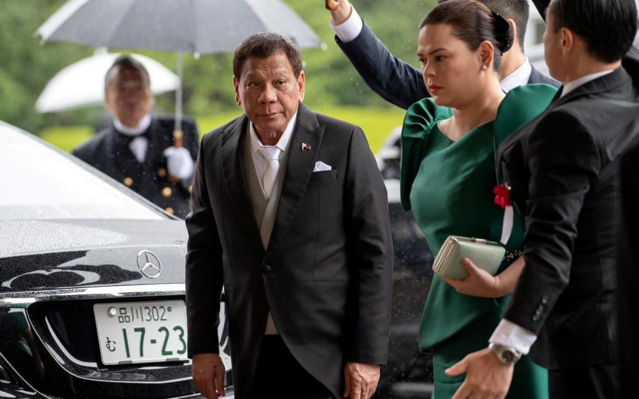 Duterte and his daughter arriving at an event - Carl Court/Pool via Reuters