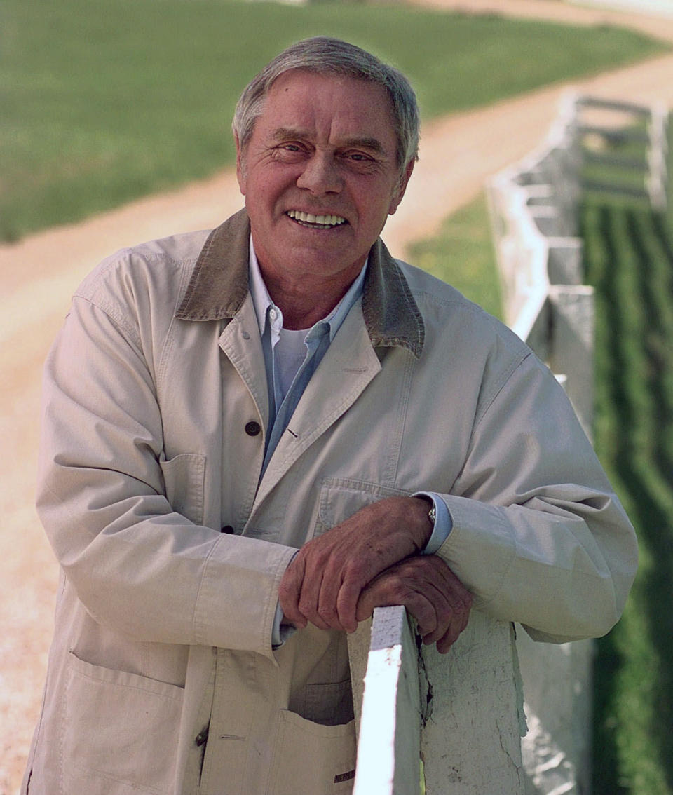FILE - In this April 1996 file photo, Country music legend Tom T. Hall, poses for a photo at his home in Franklin, Tenn. Singer-songwriter Tom T. Hall, who composed “Harper Valley P.T.A.” and sang about life’s simple joys as country music’s consummate blue collar bard, has died. He was 85. His son, Dean Hall, confirmed the musician's death Friday, Aug. 20, 2021 at his home in Franklin, Tennessee.(AP Photo/Mark Humphrey, File)