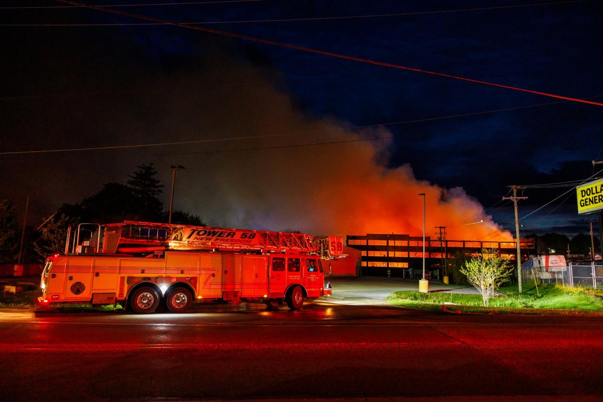 Firefighters from across the county battle a massive six-alarm inferno that ripped through the old Stewartstown Furniture Factory on Mill Street, Saturday, April 27, 2024, in Stewartstown. The fire was the largest fire in Stewartstown's history, the fire chief said.