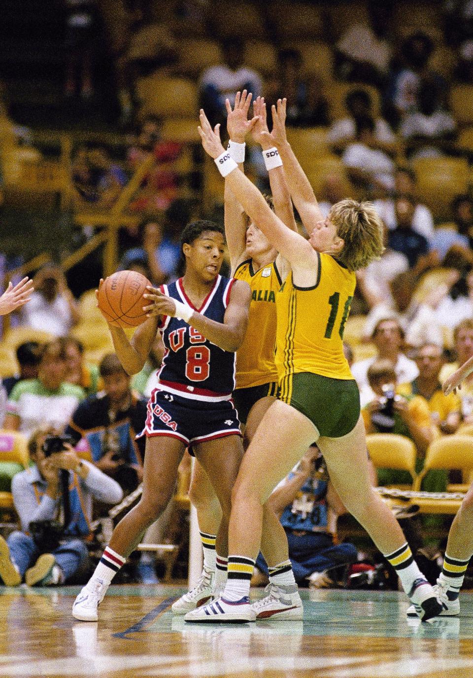 U.S.A's Cathy Boswell (left) and Australia's Patricia Mickan (right) look for the ball during Olympic basketball action, July 31, 1984 in Los Angeles. The U.S won 81-47. (AP Photo/Ray Stubblebine)