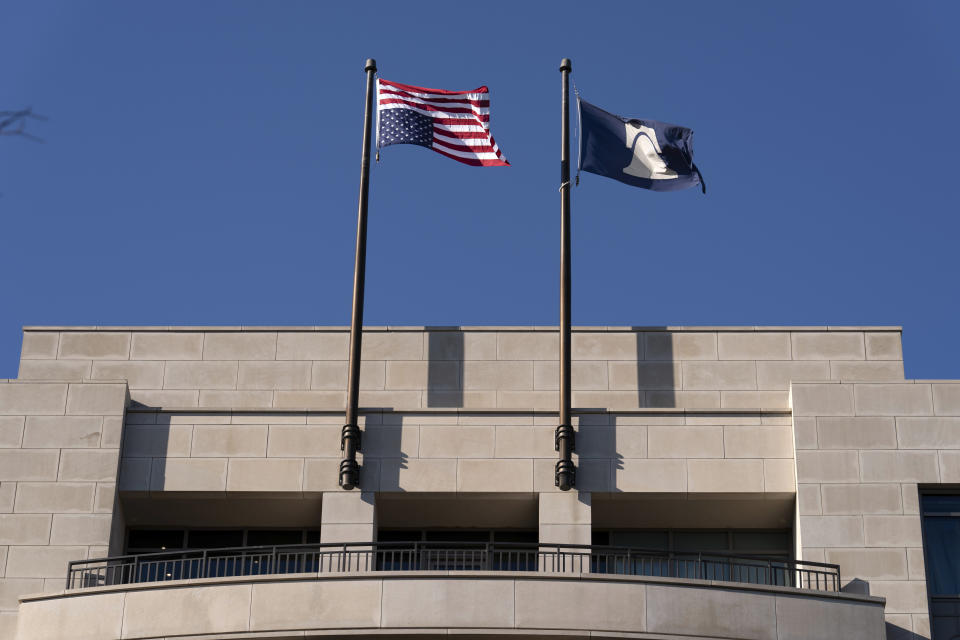 FILE - An American flag is seen upside down at the Heritage Foundation in Washington, May 31, 2024. The conservative think tank that is planning for a complete overhaul of the federal government in the event of a Republican presidential win is suggesting that President Joe Biden might try to hold the White House "by force" if he loses the November election. (AP Photo/Jose Luis Magana, File)