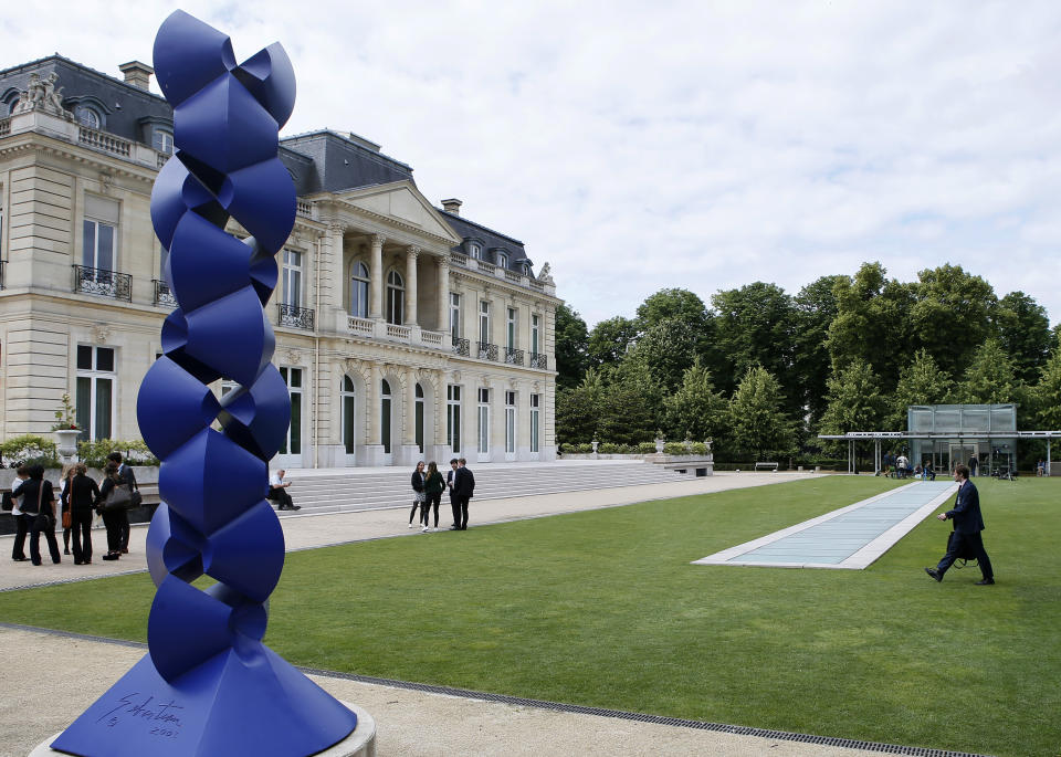 FILE - In this file photo dated Wednesday, June 7, 2017, The Organisation for Economic Co-operation and Development (OECD) headquarters in Paris, France. The Biden administration is pushing for agreement on a global minimum tax. The proposal from President Biden and Treasury Secretary Janet Yellen calls for at least a 15 percent rate to deter companies from using legal and accounting techniques to shift profits to low-tax countries. The proposal has given new energy to international talks being held in Paris and raised hopes of a deal by July. (AP Photo/Francois Mori, File)