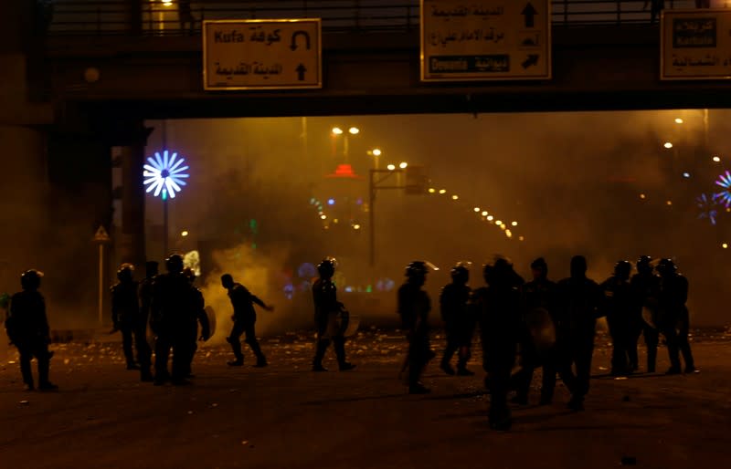 Members of riot police are seen during ongoing anti-government protests in Najaf