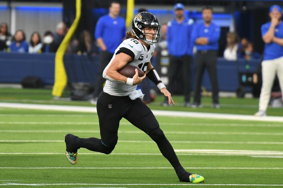 Dec 5, 2021; Inglewood, California, USA;  Jacksonville Jaguars quarterback Trevor Lawrence (16) runs against the Los Angeles Rams in the second quarter at SoFi Stadium. Mandatory Credit: Richard Mackson-USA TODAY Sports