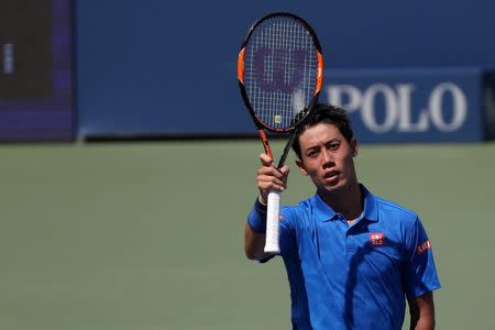 Aug 30, 2016; New York, NY, USA; Kei Nishikori of Japan waves to the crowd after his match against Benjamin Becker of Germany (not pictured) on day two of the 2016 U.S. Open tennis tournament at USTA Billie Jean King National Tennis Center. Geoff Burke-USA TODAY Sports