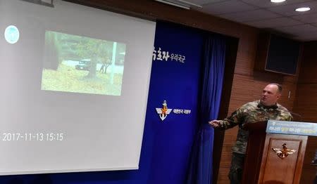 The CCTV footage regarding a North Korean soldier's defection is seen during a news conference at the Defence Ministry in Seoul, South Korea, November 22, 2017. Hwang Gwang-mo/Yonhap via REUTERS