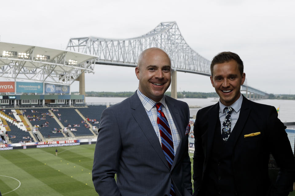 FILE - Fox Sports broadcasters Stuart Holden, right, and John Strong pose for a photo before an international friendly soccer match between the United States and Bolivia in Chester, Pa. , May 28, 2018. Ian Darke will pair with Landon Donovan as Fox’s lead broadcast team at this year’s European Championship, while John Strong and Stu Holden work the Copa América. With the tournaments overlapping, the network said Thursday, May 30, 2024, it will use seven announcing teams. (AP Photo/Matt Slocum, File)