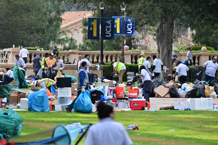 Workers clean up the University of California, Los Angeles (UCLA) campus after police evicted pro-Palestinian students, in Los Angeles, California, early on May 2, 2024. Hundreds of police tore down protest barricades and began arresting students early Thursday at the University of California, Los Angeles – the latest flashpoint in an eruption of protest on US campuses over Israel’s war against Hamas in Gaza. (Photo by Frederic J. Brown / AFP) (Photo by FREDERIC J. BROWN/AFP via Getty Images)