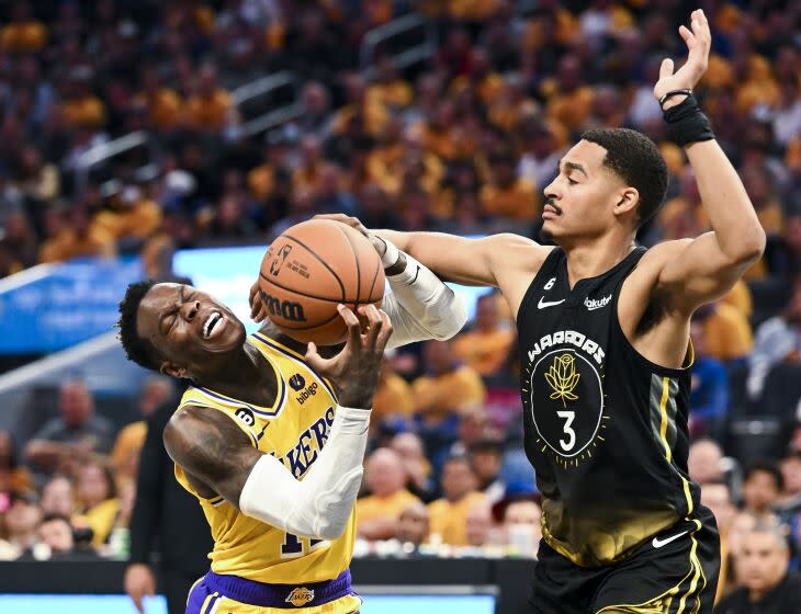 San Francisco, CA - MAY 02: Golden State Warriors guard Jordan Poole, right, fouls Los Angeles Lakers guard.