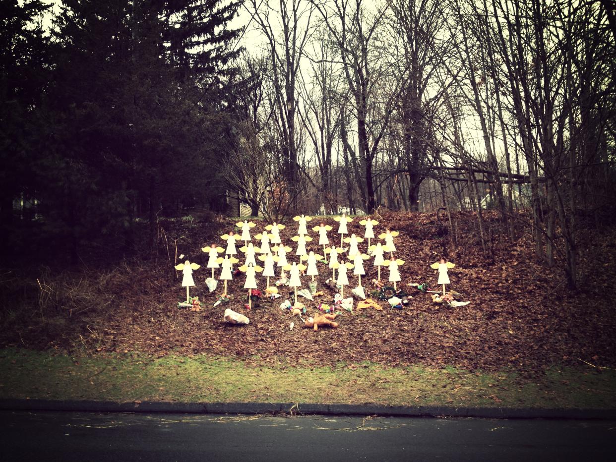 A makeshift memorial showing a grouping of angels is seen in Newtown, Conn.