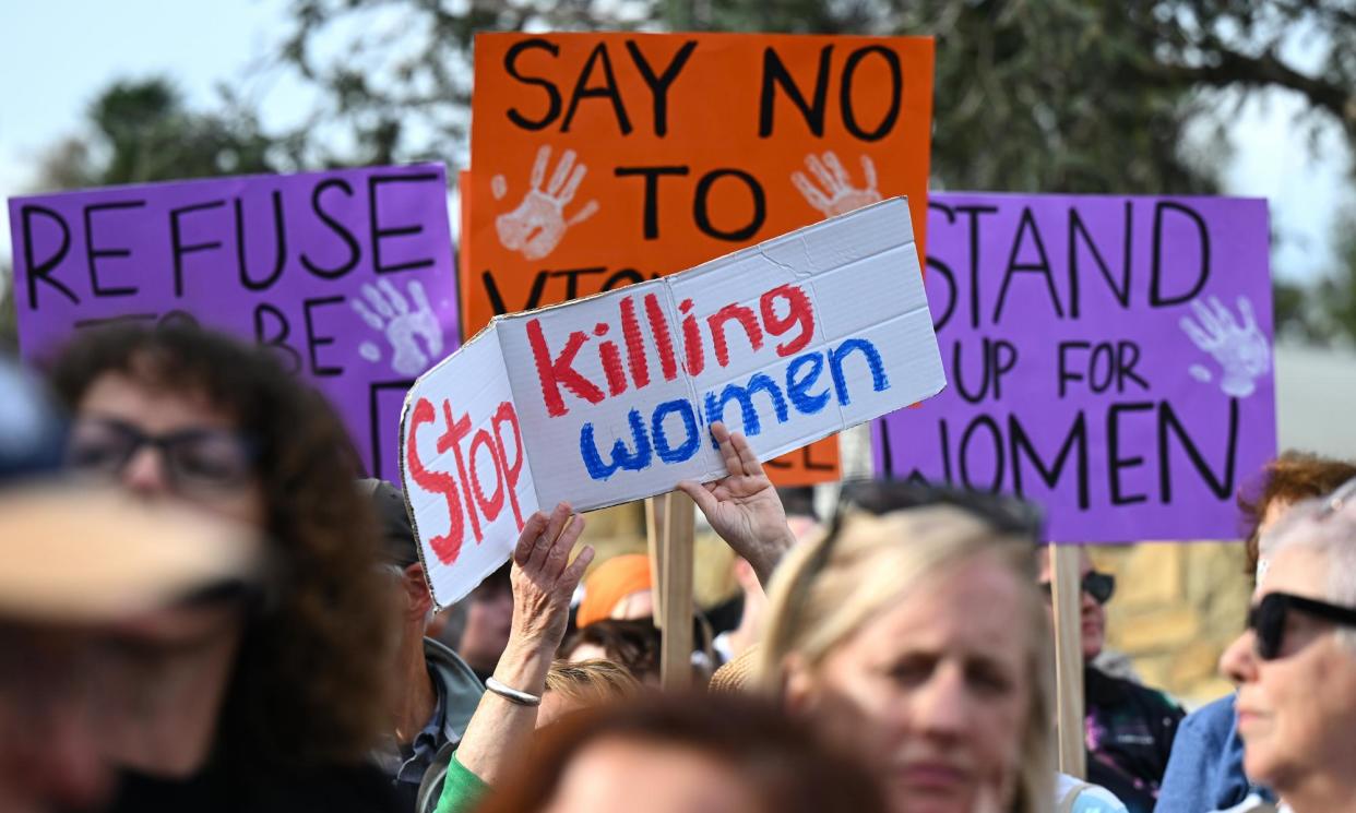 <span>People attend a rally to a call for action to end violence against women, in Canberra, Australia.</span><span>Photograph: Lukas Coch/EPA</span>