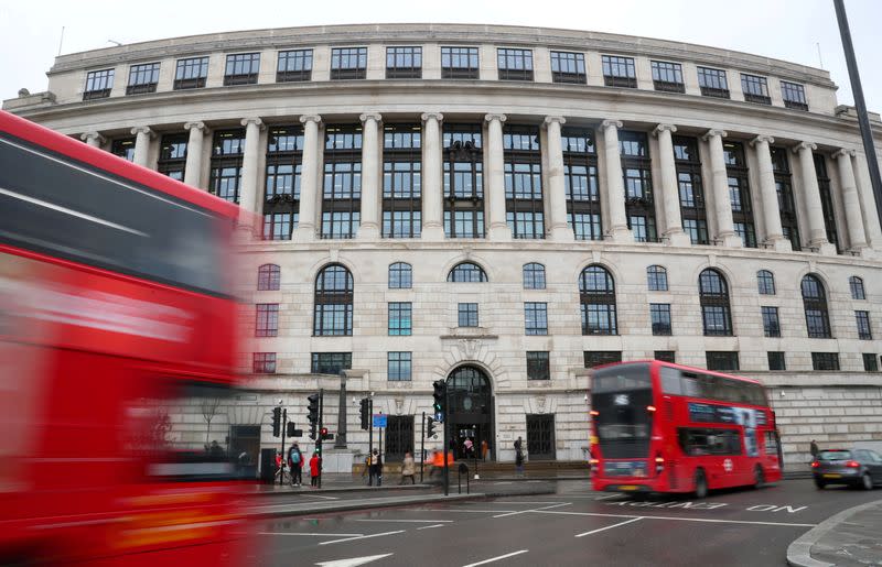 FILE PHOTO: Traffic and people pass by the front of the Unilever building in central London