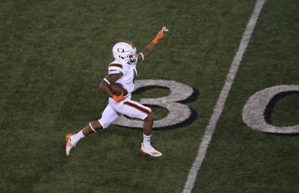 LOUISVILLE, KENTUCKY - SEPTEMBER 19:  Jaylan Knighton #4 of the Miami Hurricanes runs for a touchdown in the third quarter against the Louisville Cardinals at Cardinal Stadium on September 19, 2020 in Louisville, Kentucky. (Photo by Andy Lyons/Getty Images)