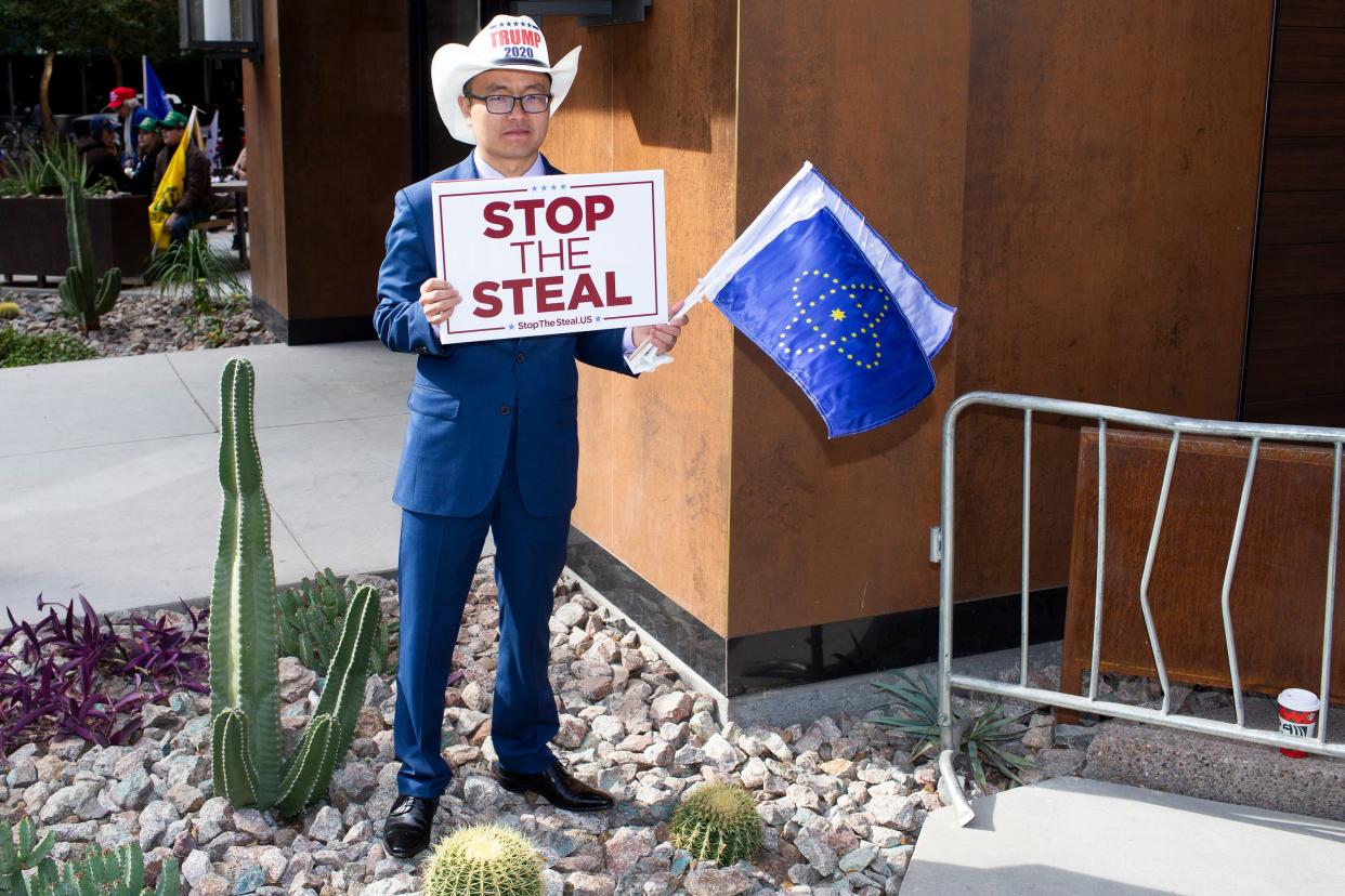 James Wang, a supporter of President Donald Trump, rallies with fellow protesters disputing President Trump's defeat in the 2020 election on Nov. 30, 2020.