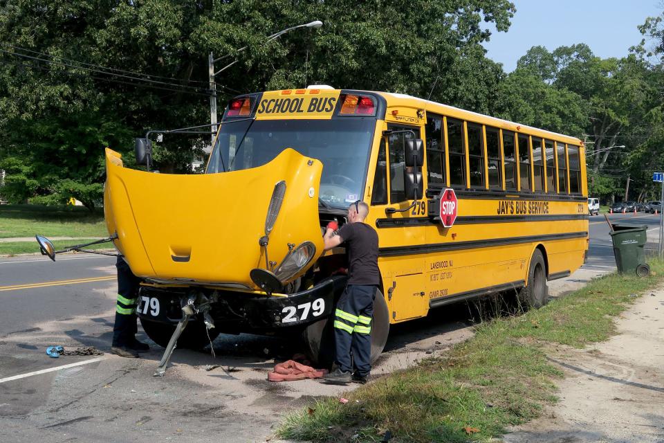 A Jay's Bus Company bus is readied to be towed from Forest Avenue, just south of 11th Street, in Lakewood Tuesday morning, September 14, 2021, where it was involved in a collision with at least three other cars.  The bus was traveling south on Forest picking up girls attending the Bais Yaakov high school.