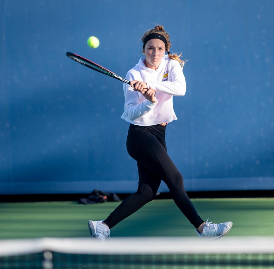 Hoover senior Laurel Utterback hits a return in her first-round win over Dasha Dotsenko of Kettering Fairmont in the Division I state tournament, Oct. 18, 2019, at the Lindner Family Tennis Center in Mason.