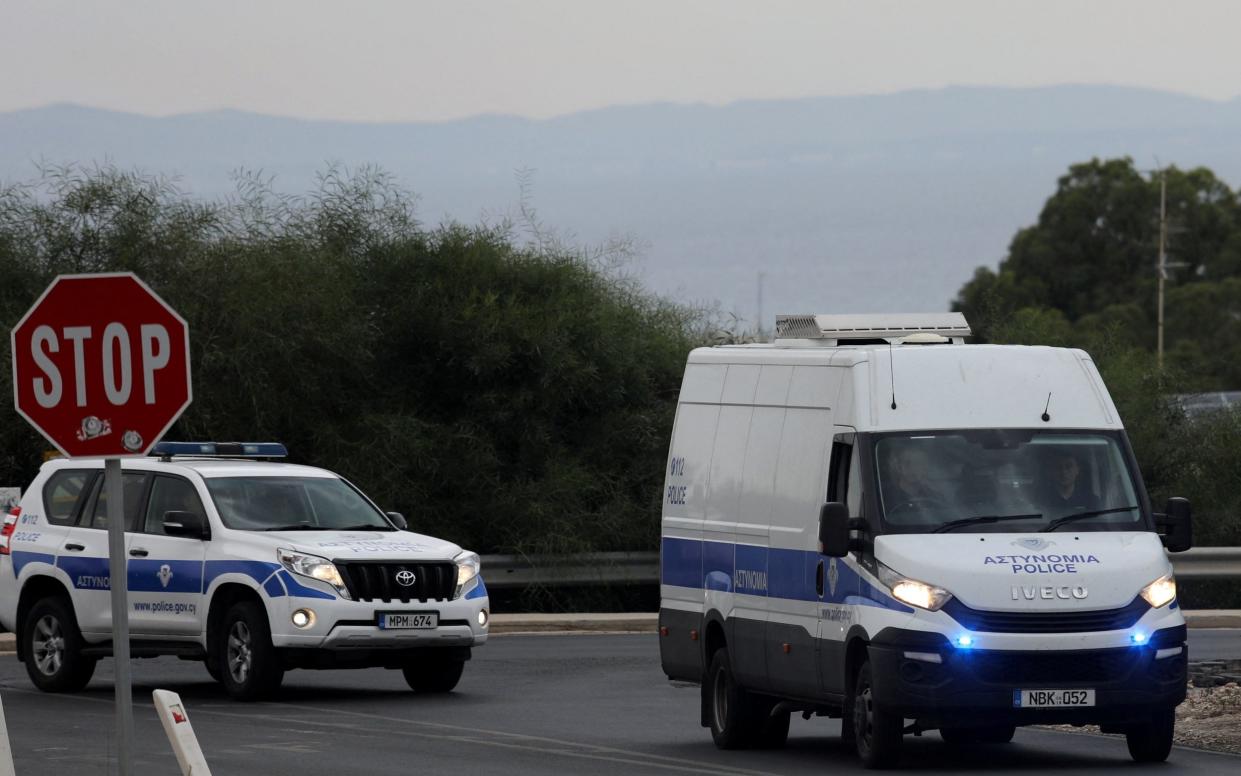 A police van carrying five Israelis, held on suspicion of raping a British tourist, arrives in the courthouse in Paralimni
