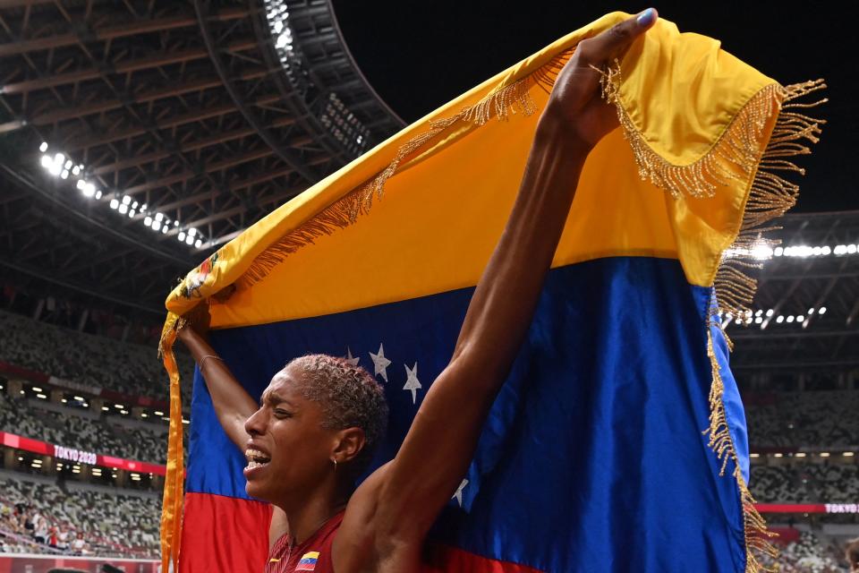 <p>Venezuela's Yulimar Rojas celebrates after winning in the women's triple jump final during the Tokyo 2020 Olympic Games at the Olympic Stadium in Tokyo on August 1, 2021. (Photo by Andrej ISAKOVIC / AFP) (Photo by ANDREJ ISAKOVIC/AFP via Getty Images)</p> 